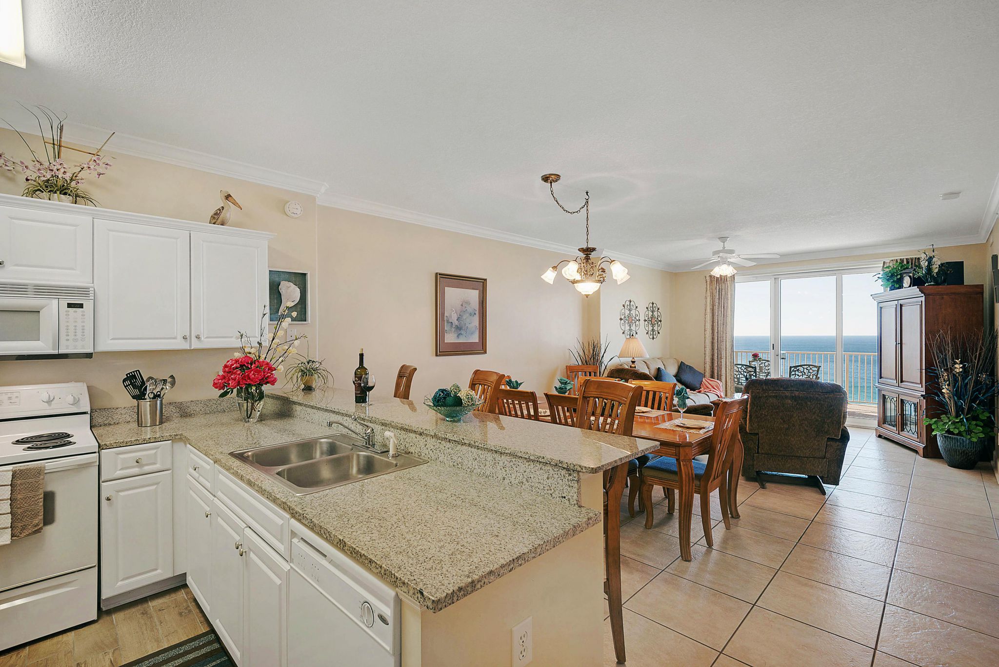 Condo kitchen with a Gulf view at Ocean Villa Condos